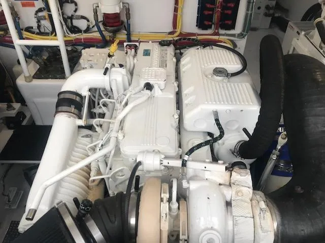 Slide: The Image of Engine room of 2016 Viking 42 Open yacht, showcasing detailed machinery and components. - 15