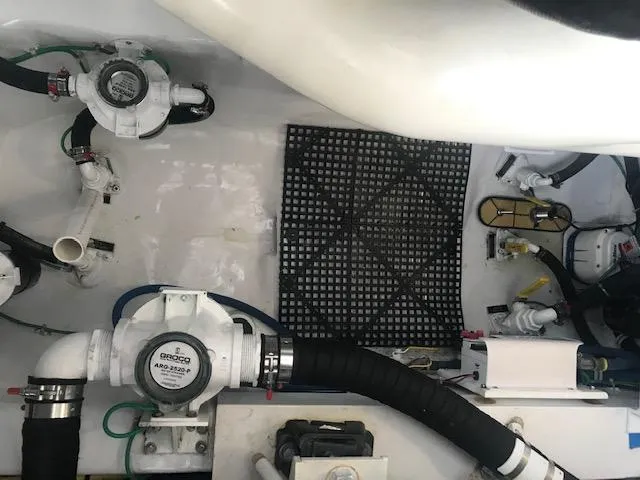 Slide: The Image of Engine room of 2016 Viking 42 Open boat with visible plumbing and equipment. - 20