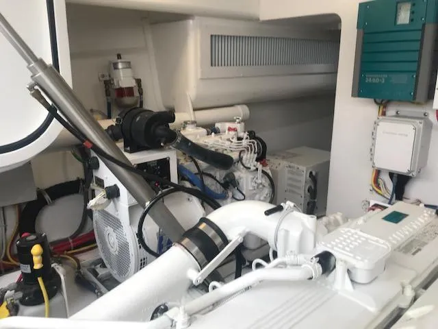 Slide: The Image of Engine room of 2016 Viking 42 Open yacht, showcasing mechanical components and systems. - 21