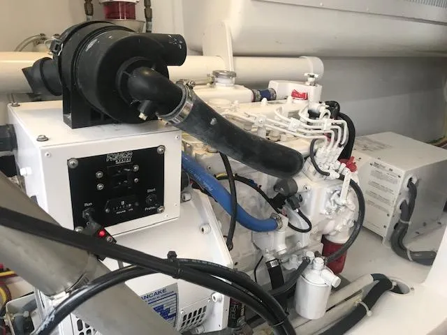 Slide: The Image of Engine room of 2016 Viking 42 Open yacht, showcasing mechanical components and systems. - 22