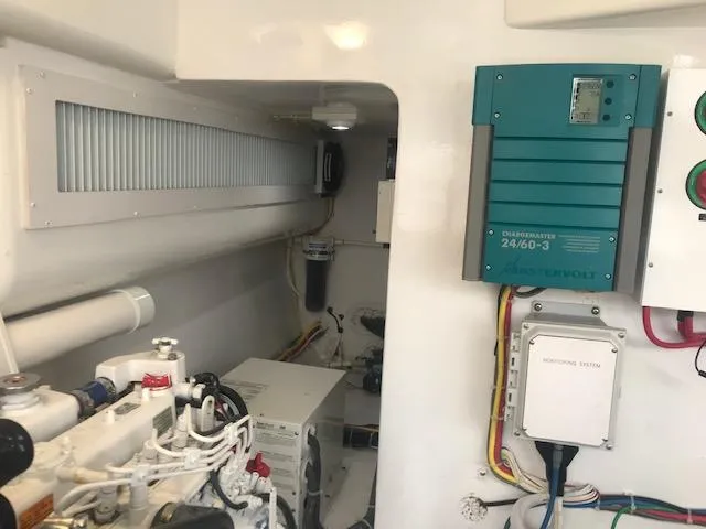 Slide: The Image of Engine room of 2016 Viking 42 Open yacht with electrical components and wiring. - 24