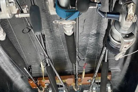 Slide: The Image of Fishing rods stored on a 2016 Viking 42 Open boat. - 26