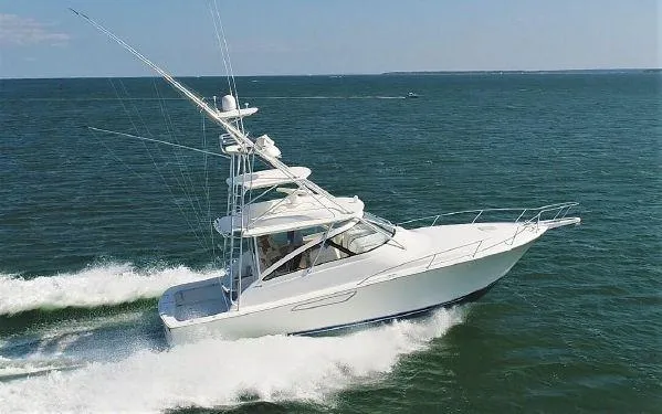 Slide: The Image of 2016 Viking 42 Open yacht cruising on open water. - 31