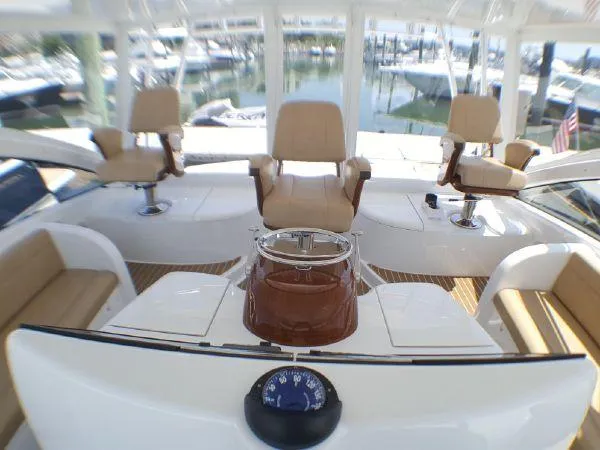 Slide: The Image of Interior of 2016 Viking 42 Open yacht with luxurious seating and helm. - 4