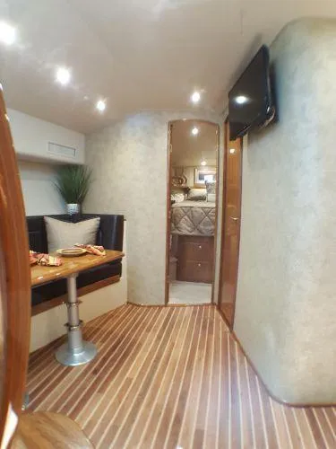 Slide: The Image of Interior of 2016 Viking 42 Open yacht with dining area and bedroom. - 8