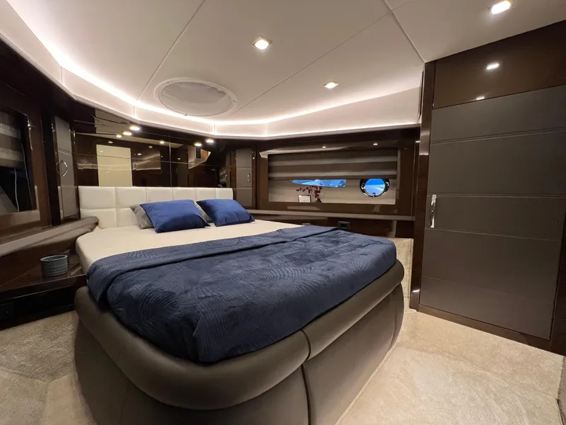 Slide: The Image of Luxurious interior of 2026 Cobrey 52 Hardtop yacht with modern bedroom design. - 2