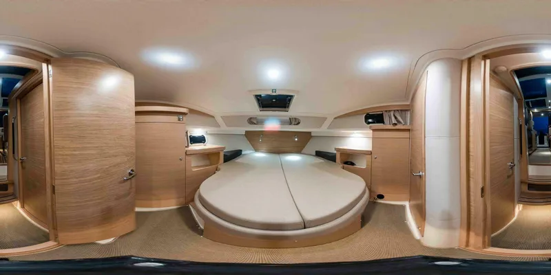 Slide: The Image of Interior of 2025 Nimbus 365 Coupe, featuring modern wood finishes and spacious design. - 13