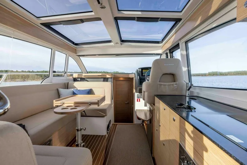 Slide: The Image of Interior of 2025 Nimbus 365 Coupe, featuring modern design and panoramic windows. - 7