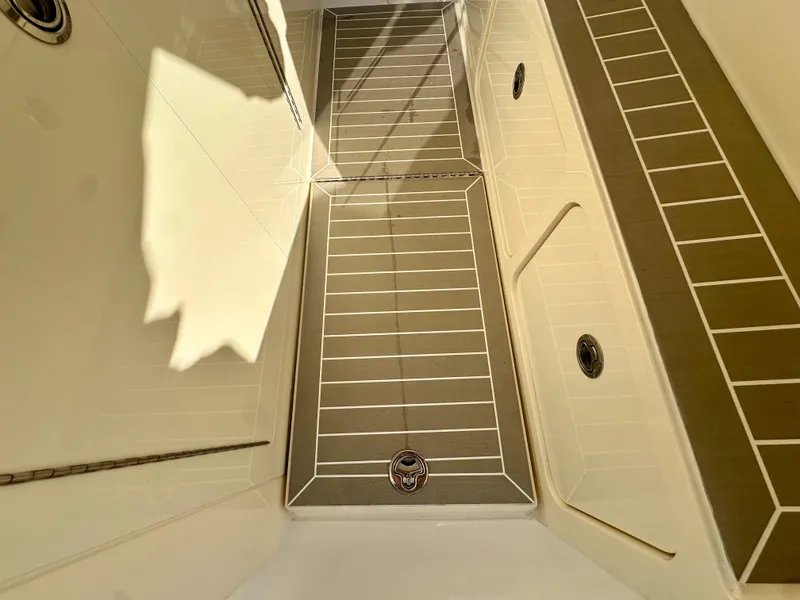 Slide: The Image of 2025 Scout 425 LXF boat interior with sleek, modern flooring design. - 20