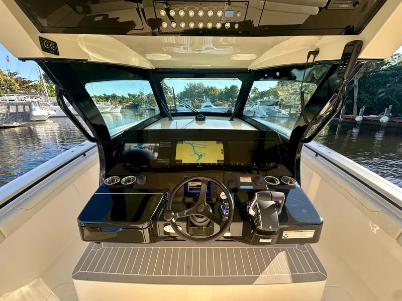 Slide: The Image of 2025 Scout 425 LXF boat cockpit with advanced navigation system and sleek design. - 5