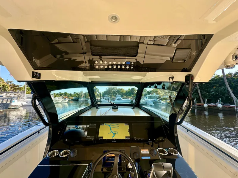 Slide: The Image of 2025 Scout 425 LXF boat cockpit with advanced navigation system and luxurious interior. - 6