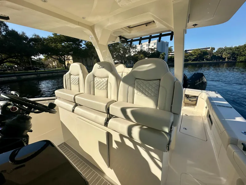 Slide: The Image of 2025 Scout 425 LXF boat interior with luxurious seating and modern design. - 7