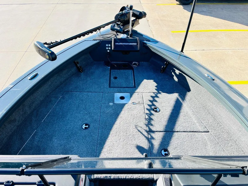 Slide: The Image of 2025 Ranger VX1988 WT boat interior with trolling motor and spacious deck. - 11