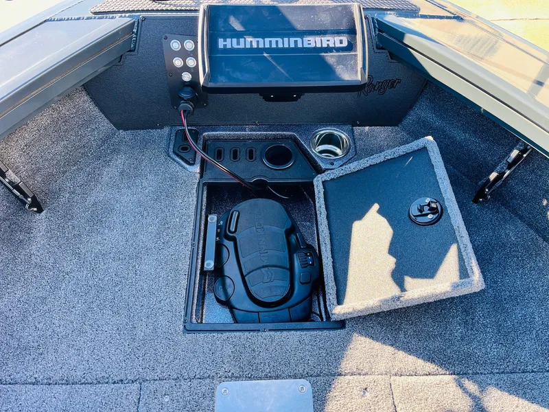 Slide: The Image of 2025 Ranger VX1988 WT boat interior with Humminbird fish finder and storage compartment. - 15