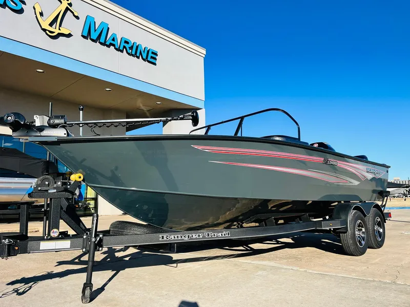 Slide: The Image of 2025 Ranger VX1988 WT boat on trailer outside marine dealership. - 2