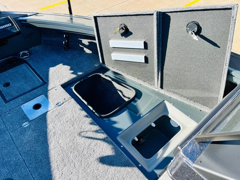 Slide: The Image of 2025 Ranger VX1988 WT boat interior with open storage compartments. - 20