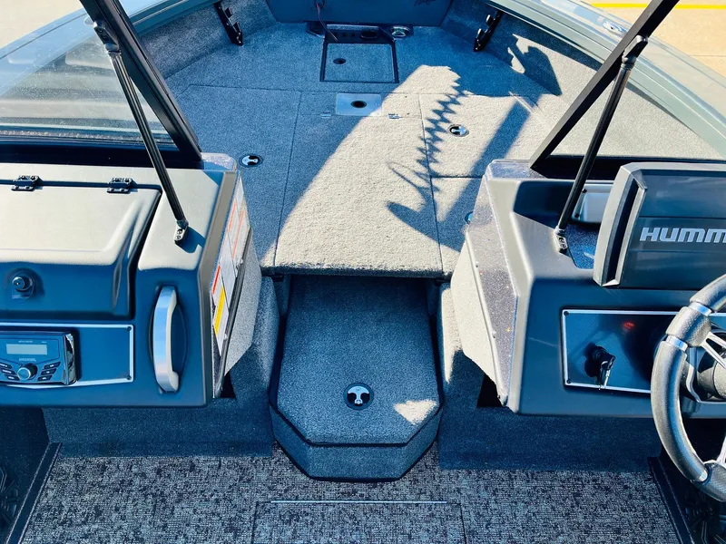 Slide: The Image of Interior of 2025 Ranger VX1988 WT boat with modern dashboard and controls. - 23