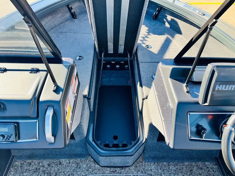 Slide: The Image of 2025 Ranger VX1988 WT boat interior with storage compartment and control panels. - 24