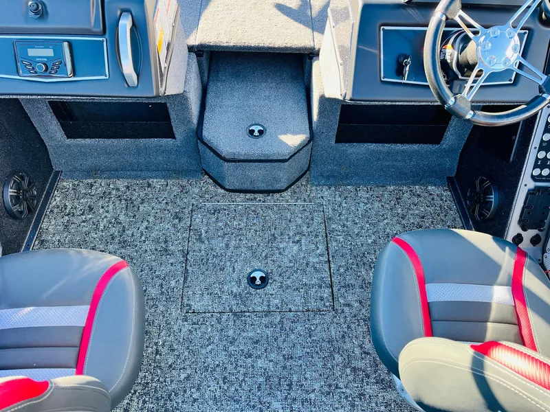 Slide: The Image of Interior of 2025 Ranger VX1988 WT boat with modern seating and steering wheel. - 26