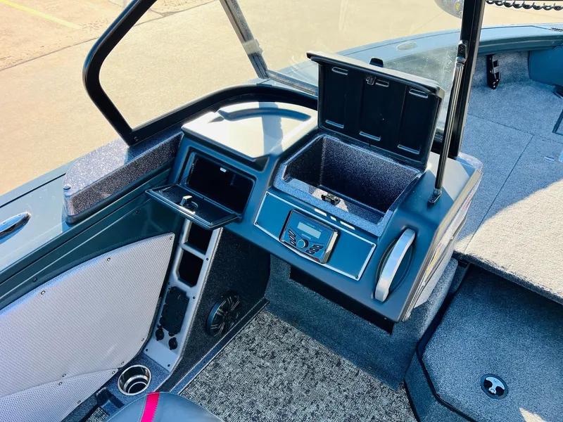 Slide: The Image of 2025 Ranger VX1988 WT boat interior with storage compartments and control panel. - 29