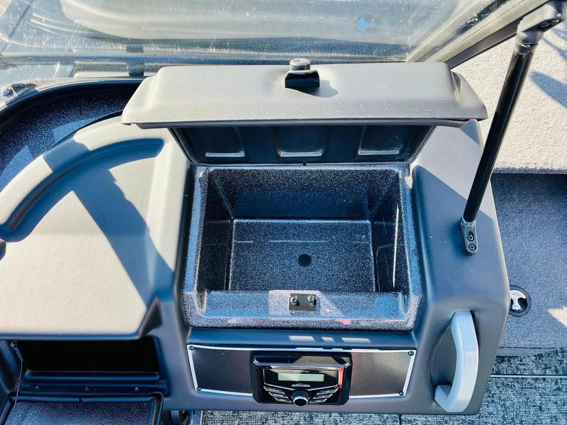 Slide: The Image of Open storage compartment in a 2025 Ranger VX1988 WT boat dashboard. - 30