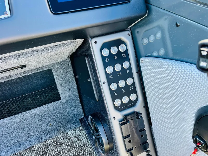Slide: The Image of Control panel of 2025 Ranger VX1988 WT boat with various buttons and switches. - 37