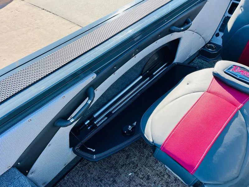 Slide: The Image of Interior of 2025 Ranger VX1988 WT boat with red and gray seating. - 42