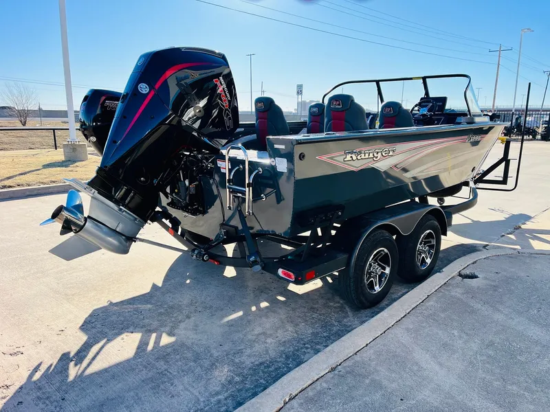 Slide: The Image of 2025 Ranger VX1988 WT boat on trailer, featuring powerful outboard motor. - 5