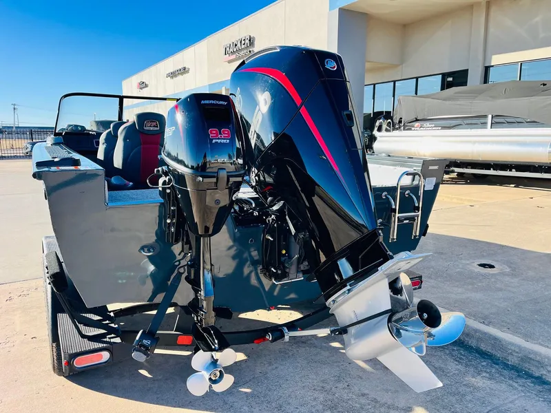 Slide: The Image of 2025 Ranger VX1988 WT boat with dual outboard motors, displayed outdoors. - 8