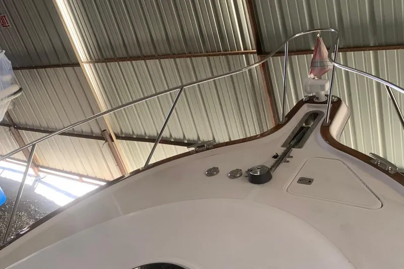 Slide: The Image of 2012 Tiara Yachts 3100 Coronet in a covered storage area. - 14