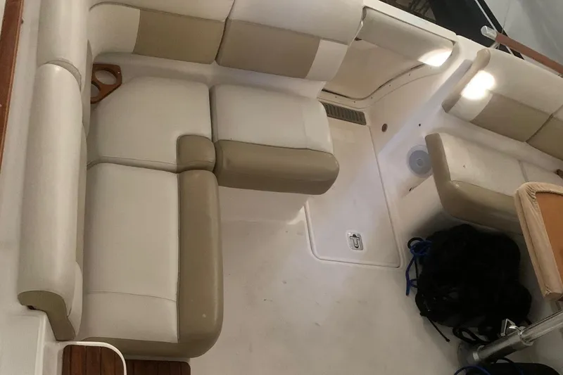 Slide: The Image of Interior seating of 2012 Tiara Yachts 3100 Coronet, featuring beige and cream upholstery. - 15