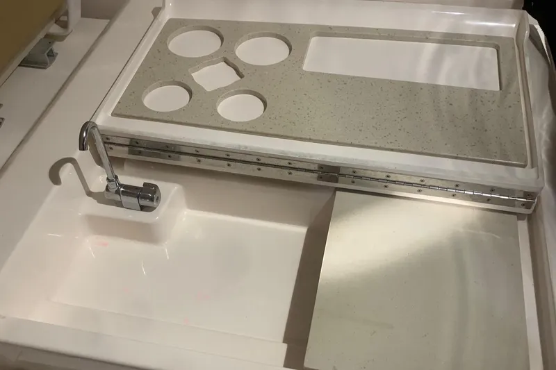 Slide: The Image of Tiara Yachts 3100 Coronet 2012 boat sink and countertop with cup holders. - 16