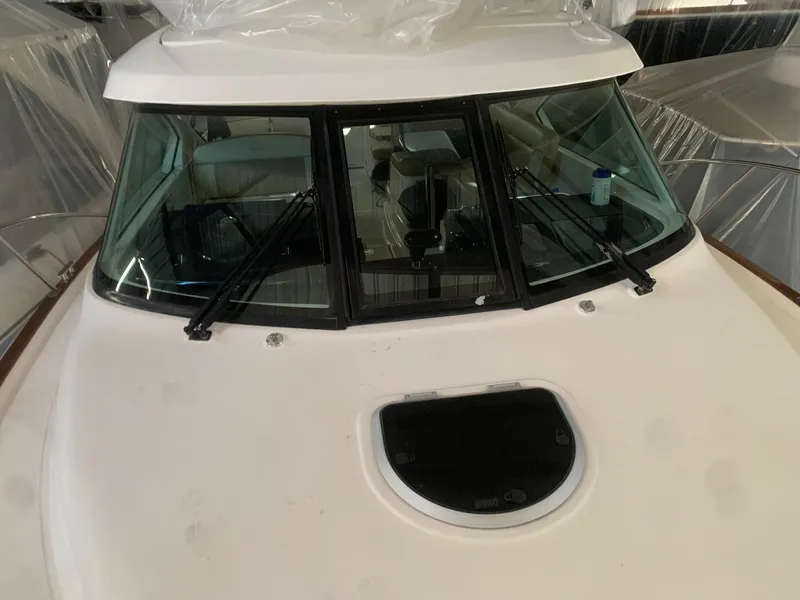 Slide: The Image of 2012 Tiara Yachts 3100 Coronet boat windshield and deck view. - 2