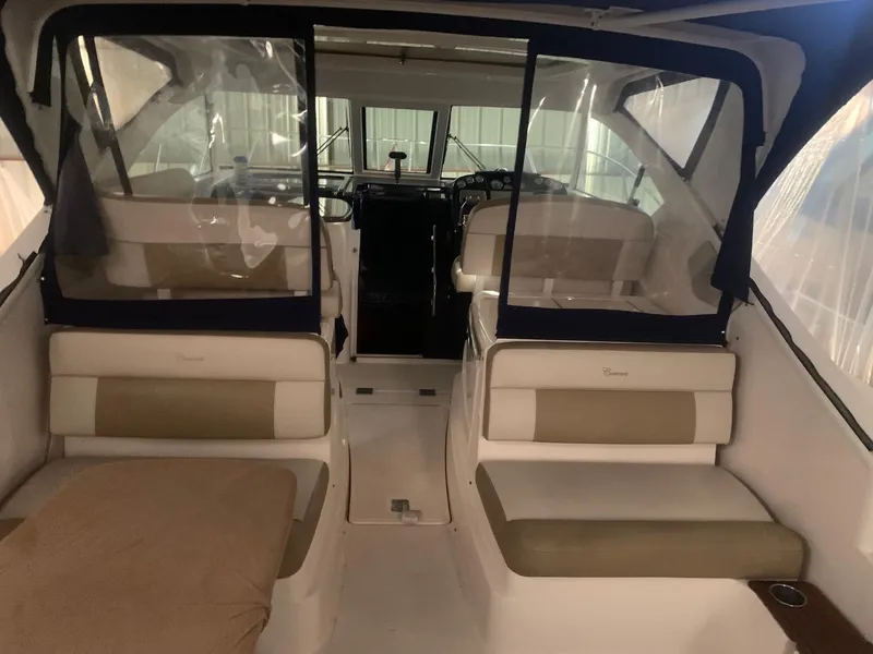 Slide: The Image of 2012 Tiara Yachts 3100 Coronet interior with seating and helm. - 5