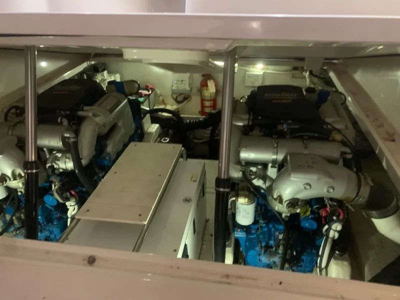 Slide: The Image of Engine compartment of 2012 Tiara Yachts 3100 Coronet, showcasing dual engines and equipment. - 8
