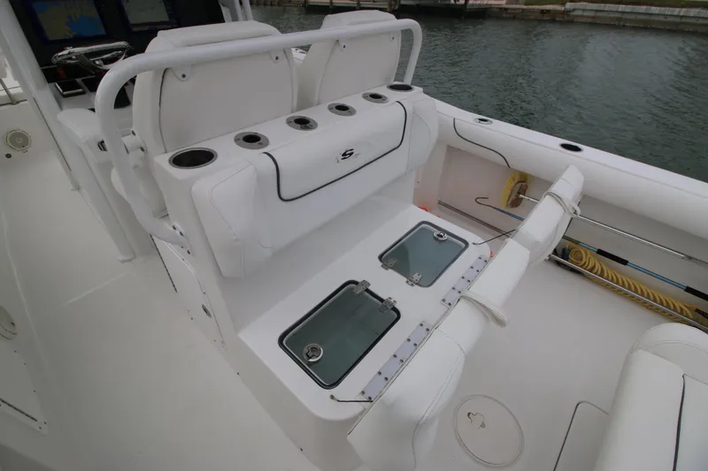 Slide: The Image of 2016 Sea Hunt Gamefish 30 boat interior with seating and storage compartments. - 13