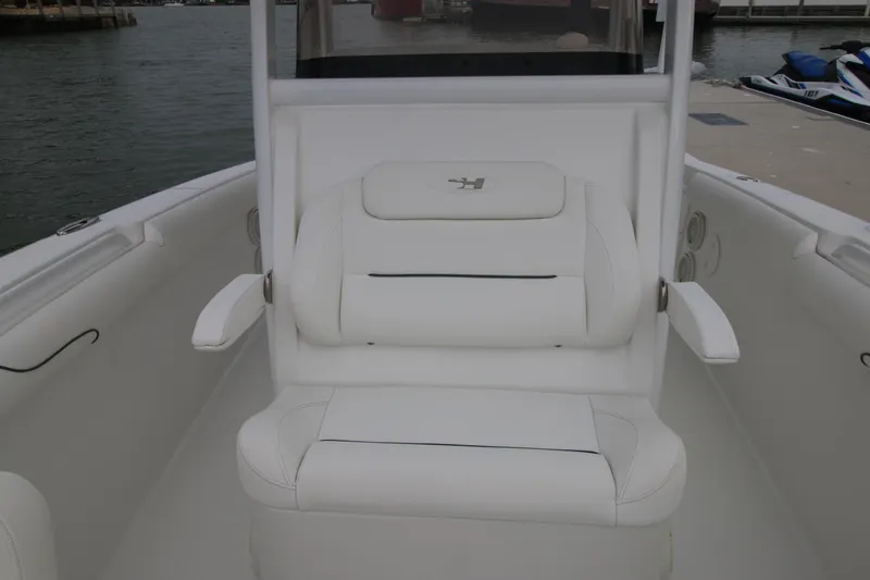 Slide: The Image of 2016 Sea Hunt Gamefish 30 boat seating area with white upholstery. - 14