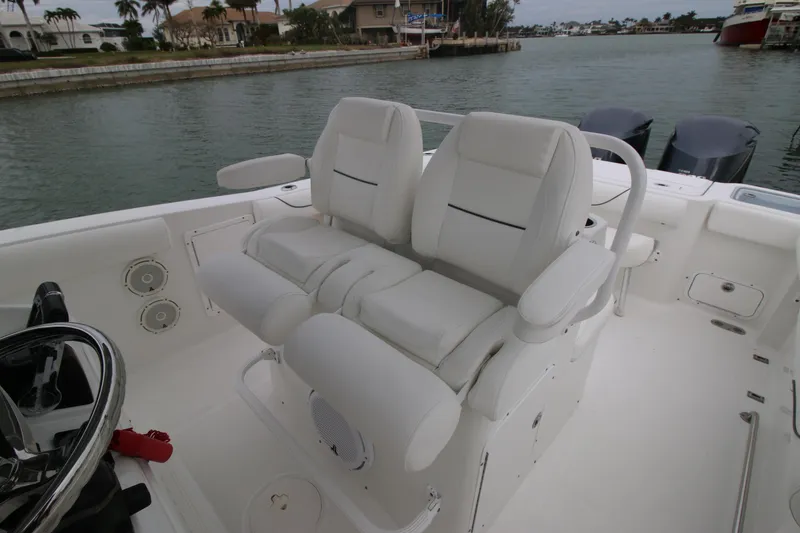 Slide: The Image of 2016 Sea Hunt Gamefish 30 boat interior with dual white captain's chairs. - 15