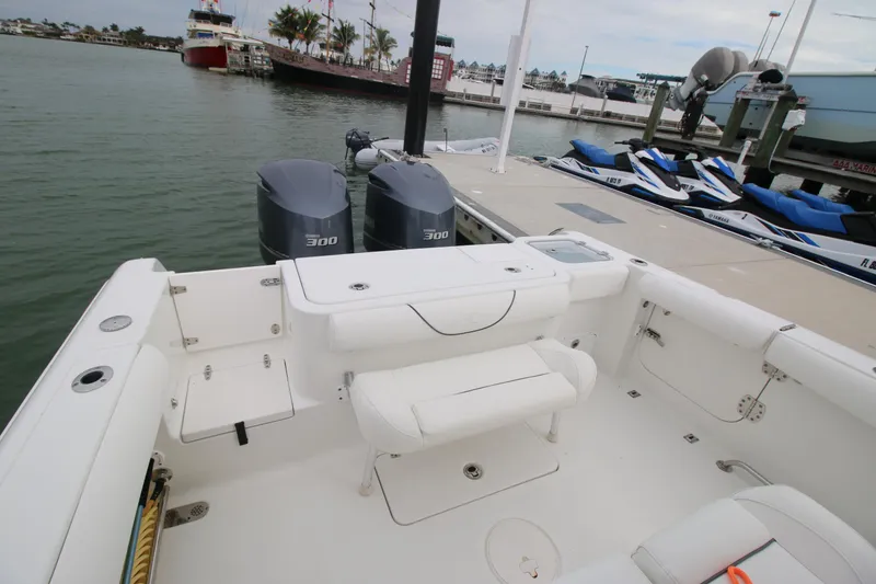 Slide: The Image of 2016 Sea Hunt Gamefish 30 boat with dual engines docked at marina. - 19