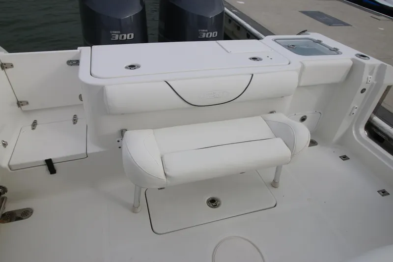 Slide: The Image of 2016 Sea Hunt Gamefish 30 boat interior with seating and twin engines. - 29