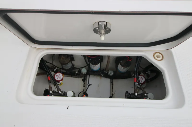Slide: The Image of 2016 Sea Hunt Gamefish 30 boat compartment with visible wiring and components. - 31