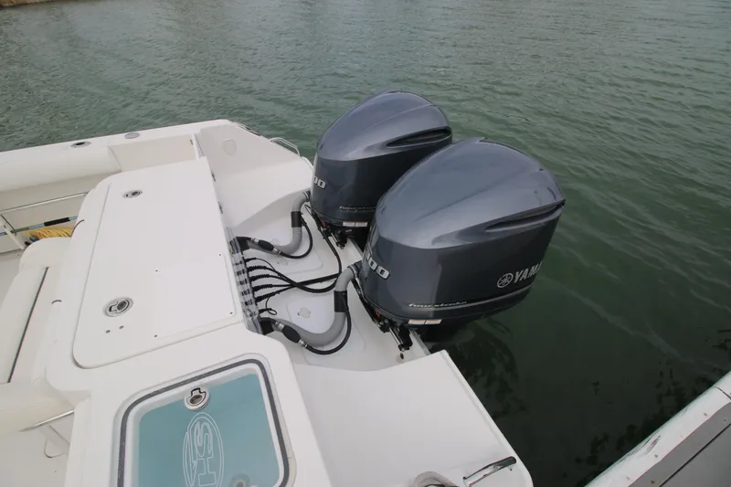 Slide: The Image of 2016 Sea Hunt Gamefish 30 with dual Yamaha outboard motors on water. - 37