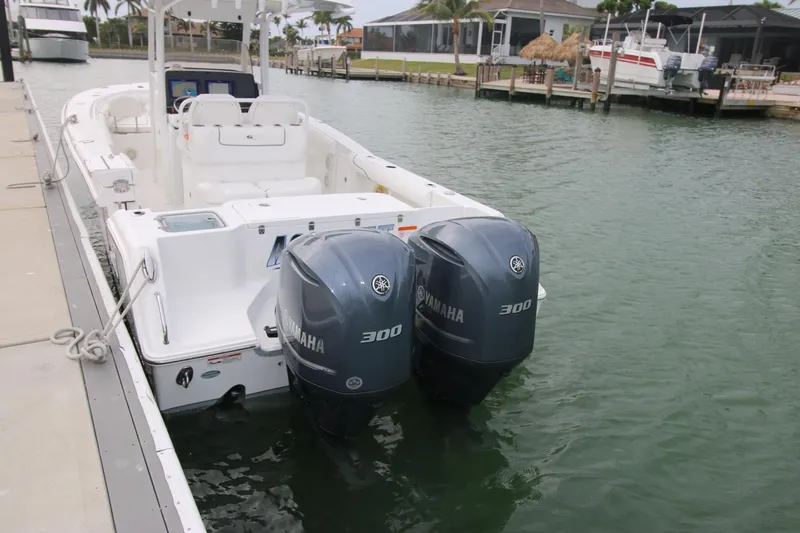 Slide: The Image of 2016 Sea Hunt Gamefish 30 with twin Yamaha 300 engines docked in marina. - 39