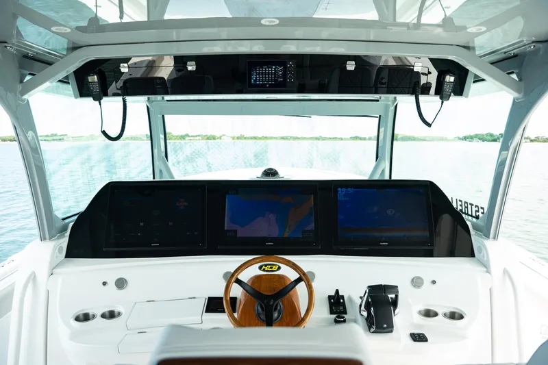 Slide: The Image of 2023 HCB 65 Estrella helm with advanced navigation displays and controls. - 14