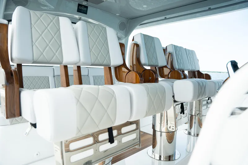 Slide: The Image of Luxurious seating on 2023 HCB 65 Estrella yacht with elegant white and wood design. - 16
