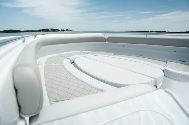 Slide: The Image of Luxurious seating on 2023 HCB 65 Estrella yacht under clear skies. - 19