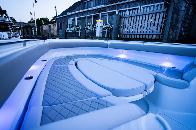 Slide: The Image of Luxurious seating area on 2023 HCB 65 Estrella boat with ambient lighting. - 23