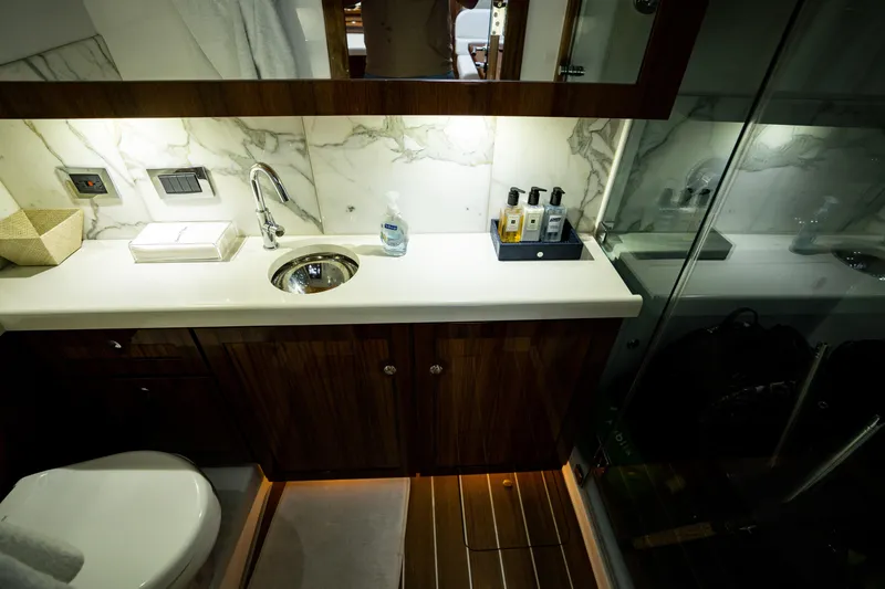 Slide: The Image of Luxurious bathroom in 2023 HCB 65 Estrella yacht with marble accents and modern amenities. - 28