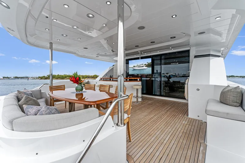 Slide: The Image of Luxurious 2006 Palmer Johnson motor yacht deck with seating and bar area. - 15