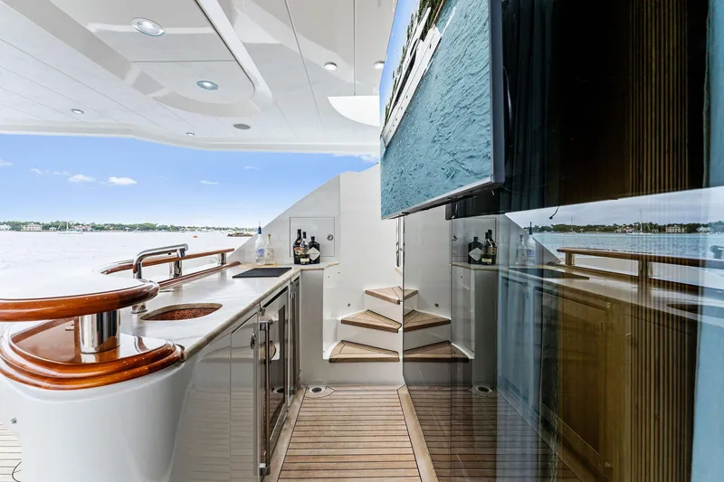 Slide: The Image of Palmer Johnson 2006 motor yacht with jet skis and flags on deck. - 20